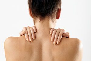 Woman with sore shoulder and back.